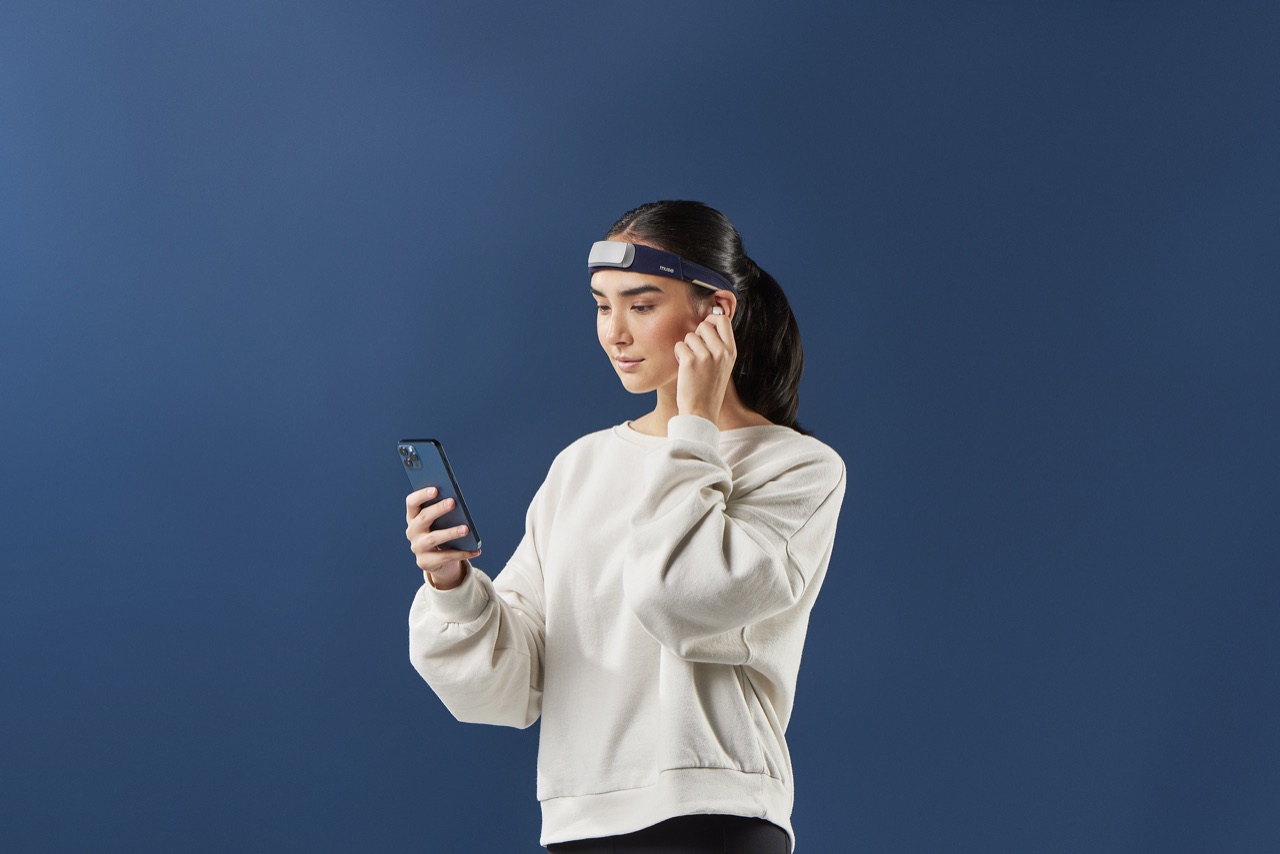 A person wearing a Muse S EEG headband while focused on a task